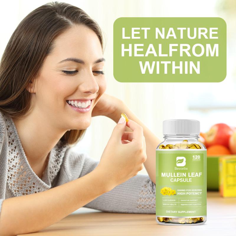 Woman taking a Mullein Leaf Capsule with a bottle of capsules on a table, surrounded by fruits.