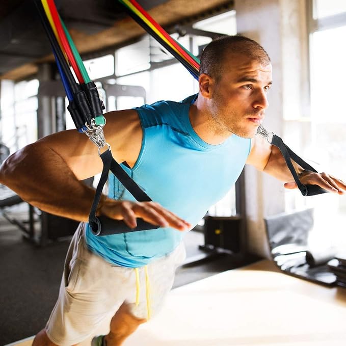 Man exercising with resistance bands in a home setting